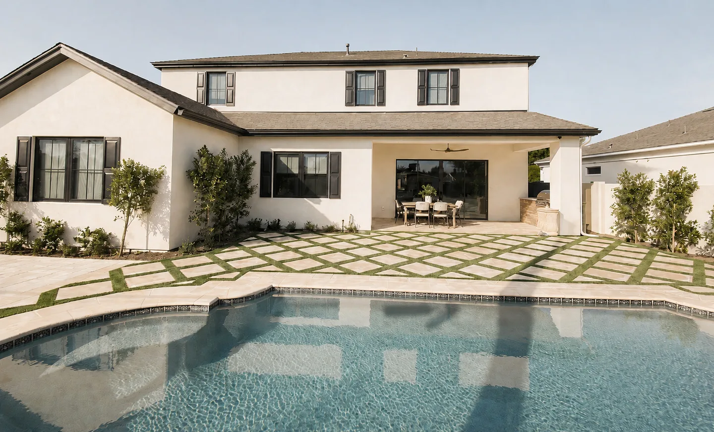 Concept image of a pool and patterned paver courtyard
